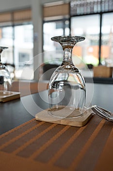Empty water glasses upside down on the table