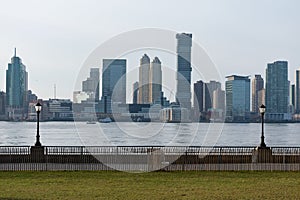 Empty Waterfront at Battery Park in New York City with a view of the Jersey City Skyline along the Hudson River