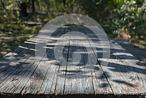 Empty weathered wood boards table, perspective side view empty backdrop