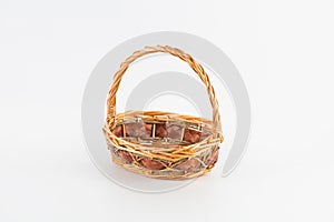 Empty weaved fruit and bread basket isolated on a white background