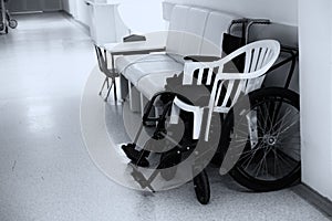 Empty wheelchair in the hospital corridor