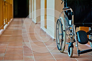 Empty wheelchair in hospital corridor