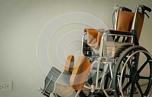 Empty wheelchair near wall in hospital for service patient and people with disability. Medical equipment in hospital for