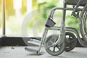 Empty wheelchair parked in hospital