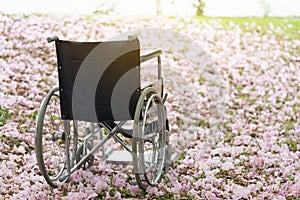 Empty wheelchair parked in hospital