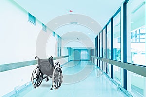 Empty wheelchair parked in hospital hallway