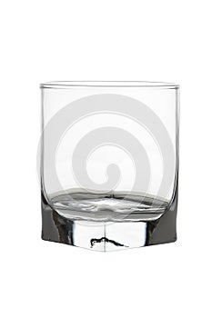 Empty whisky glass isolated on white background