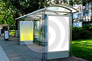 Empty white ad panel and light box for mockup at city transit busstop