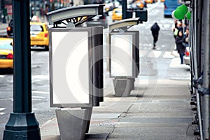 Empty white billboards on two public phone booth photo