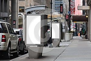 Empty white billboards on two public phone booth