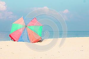 One parasol at a empty beach