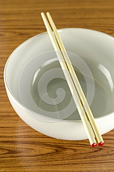 Empty white bowl with chopstick