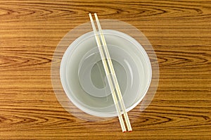 Empty white bowl with chopstick