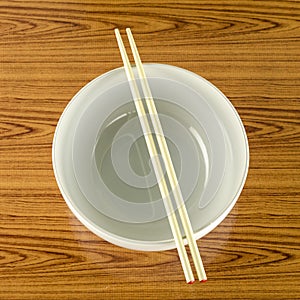 Empty white bowl with chopstick