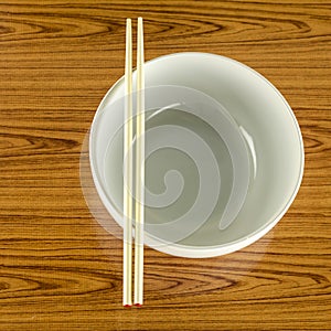 Empty white bowl with chopstick