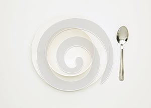 Empty white bowl on plate