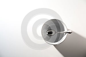 Empty White Bowl with Spoon on a White Background