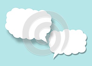 Empty white cloud paper speech bubble shape against light blue background