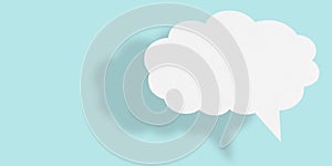 Empty white cloud paper speech bubble shape against light blue background