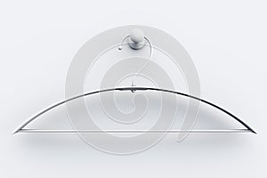 Empty white coat hanger on a light background