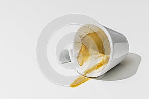 empty white coffee cup upturned