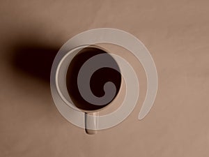 Empty white cup on a light background. Cup with place for text. Copyspace