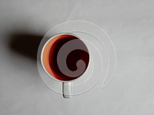 Empty white cup on a light background. Cup with place for text. Copyspace