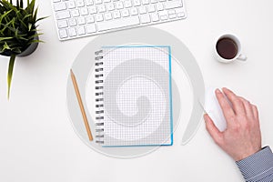 Empty white desk office with glasses pencil coffee and keyboard