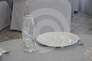 Empty white dinner plate on a table