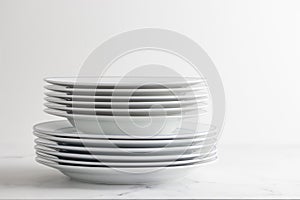 Empty white dinner plate on a white background