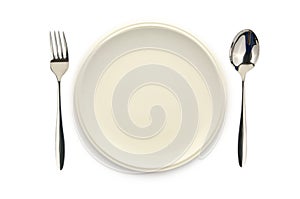 Empty white dish spoon and fork