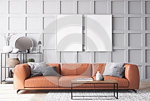 Empty white frame mock up. Orange leather sofa in Scandinavian living room. Gray background wall, home decoration