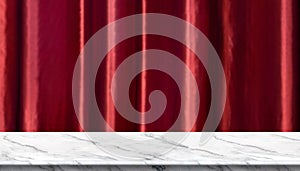 Empty white marble table and blurred vivid red luxury curtain background. product display template.Business presentation