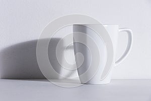 Empty white mug with shadow
