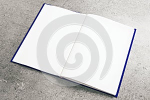 Empty white notepad on concrete surface