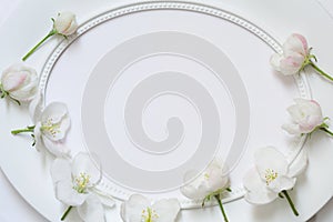 Empty white oval frame with delicate Apple blossoms. blank with flowers. mockup card for womens day wedding