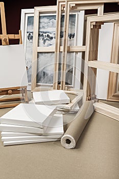 Empty white painter canvases and canvas roll and easel - painter program