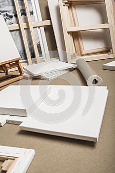 Empty white painter canvases and canvas roll and easel - painter program