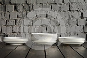 Empty white plate on a wooden loft table