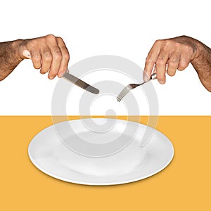 Empty white plate on a yellow background and hands with a knife and fork are not white background