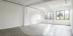 Empty white room corner with bright walls