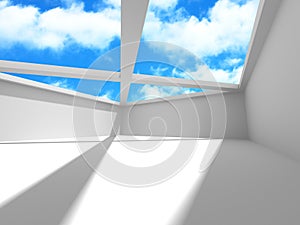 Empty white room interior with window to sky