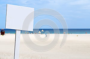 Empty white sign at the beach
