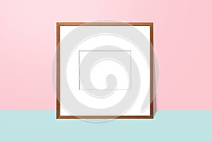 Empty white space in wooden blank frame leaning against with pink wall