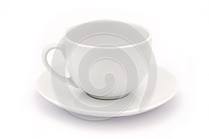 Empty white tea cup and saucer