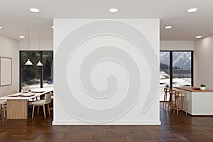 Empty white wall mockup in a modern, luxurious spacious room with a dining room and kitchen