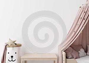 Empty white wall in modern child room. Mock up interior in scandinavian style. Copy space for your picture or poster