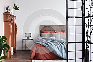 Empty white wall of rustic bedroom interior