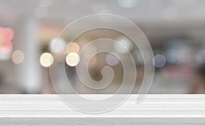 Empty white wood tabletop, desk over blur soft light in restaurant bokeh background