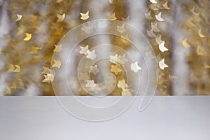 Empty white wooden background with bokeh golden lights stars. Christmas or party background